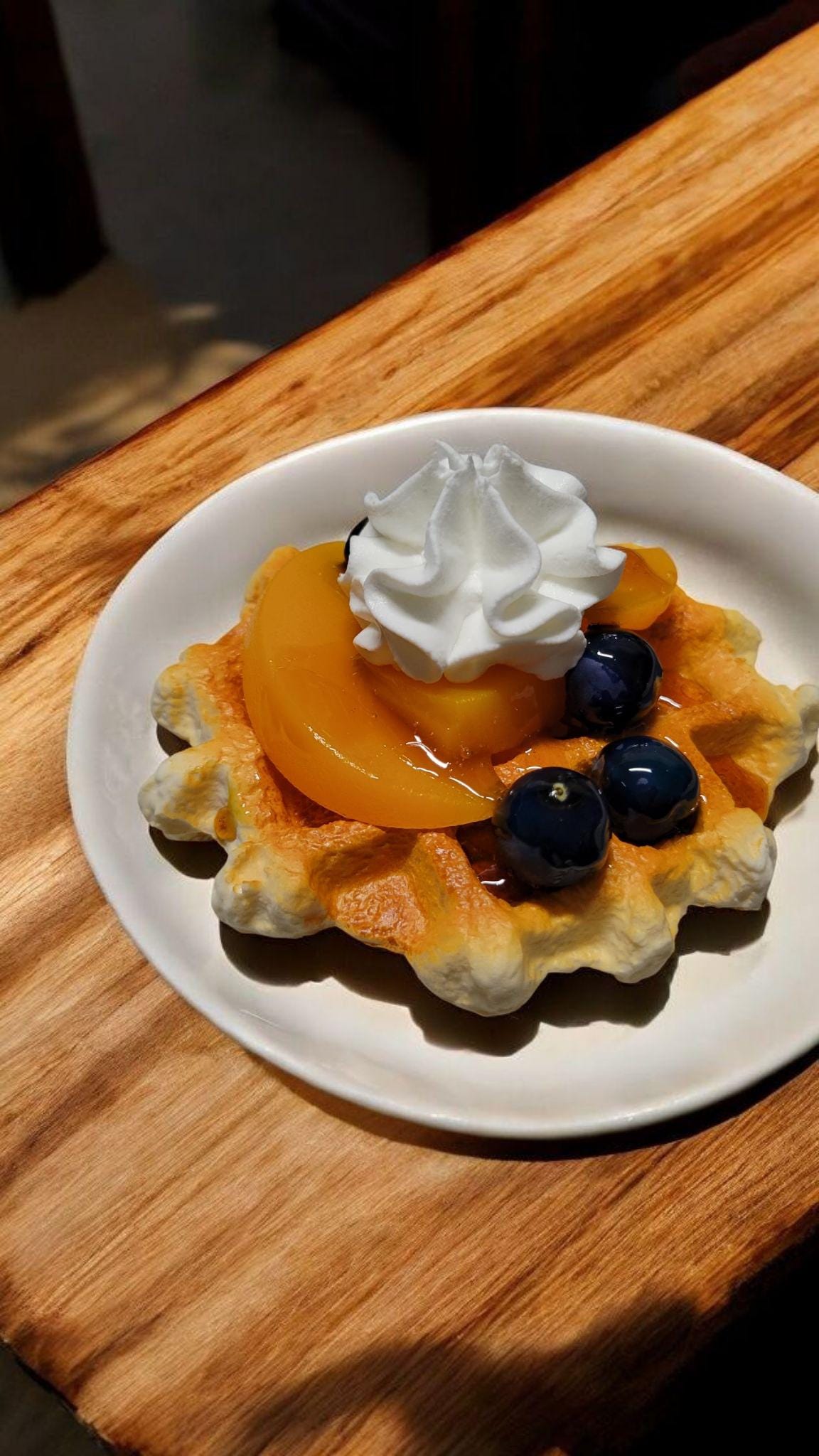 Zero calorie faux vanilla waffle with peaches and blueberries