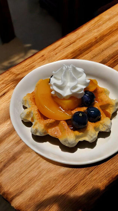 Zero calorie faux vanilla waffle with peaches and blueberries